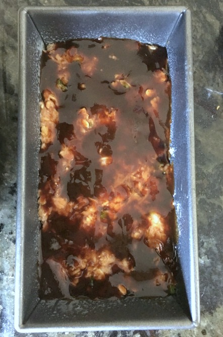 Barbecue sauce spread over the raw turkey mixture.