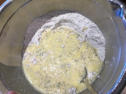 Wet and dry ingredients in a bowl, ready to mix.