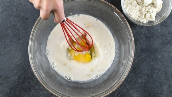 whisking the wet ingredients in a bowl