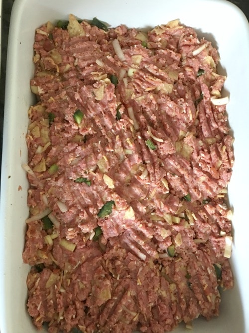 Meatloaf in a pan ready to bake.