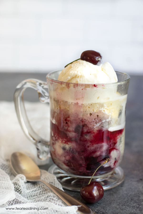 A cherry cobbler mug cake ready to eat.