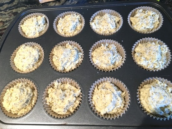 The muffin batter in a muffin tin ready to bake.
