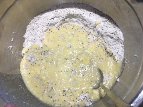 The wet and dry muffin ingredients in a bowl about to get mixed.