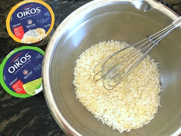 Gluten free tart crust ingredients in a bowl with a whisk.