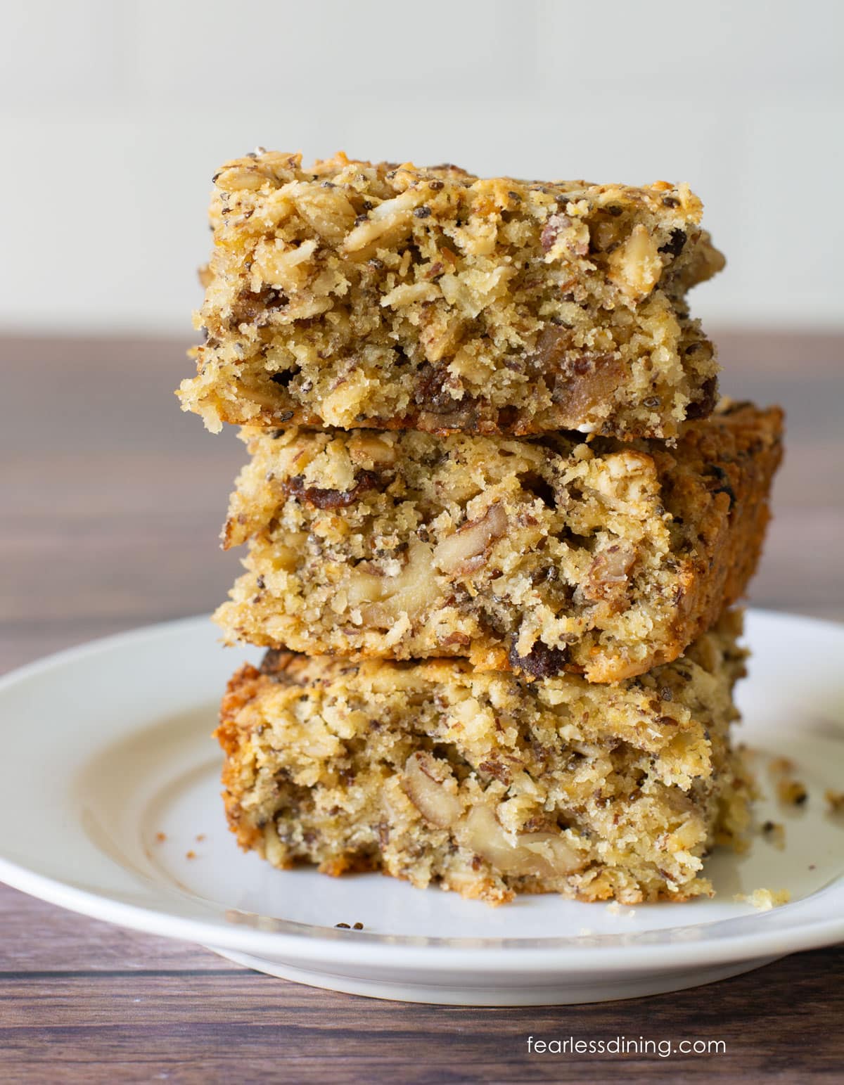 A stack of three gluten-free breakfast bars on a plate.