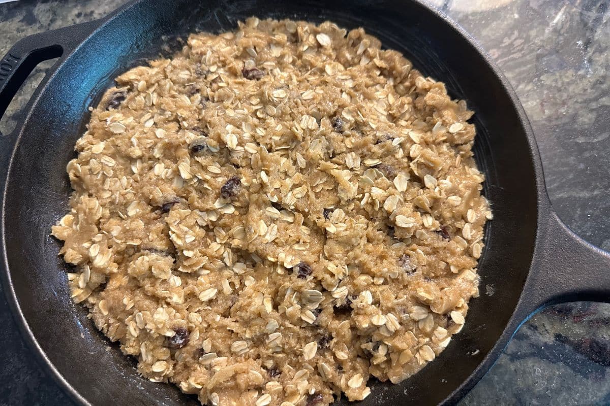 The oatmeal cookie dough in the cast iron skillet.