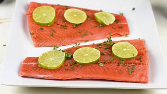 Top view of the salmon with herbs.