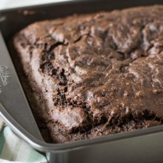 A delicious gluten free chocolate cake in an 8x8 pan.