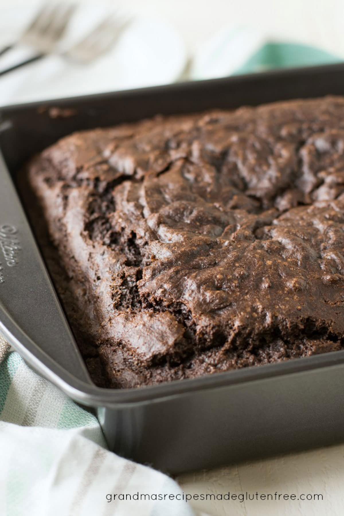 A delicious gluten free chocolate cake in an 8x8 pan.