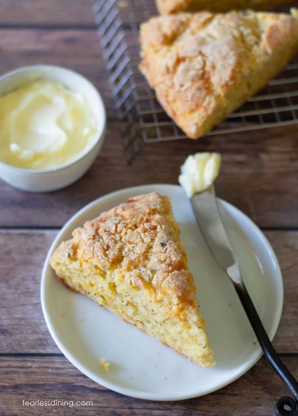 The top view of a cheddar scone on a plate.