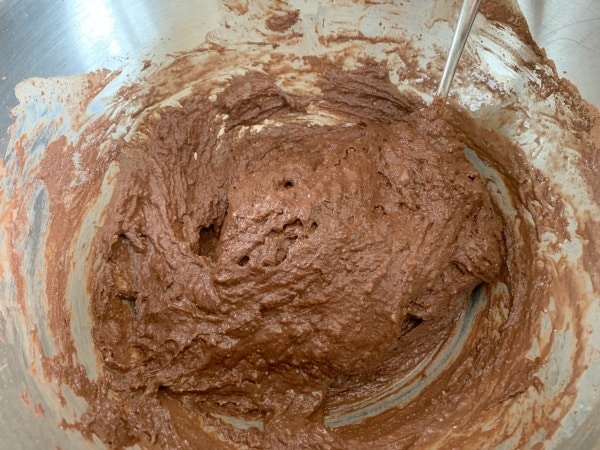 The chocolate donut batter in a bowl.