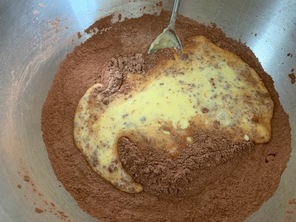 The dry and wet ingredients in a bowl ready to blend.