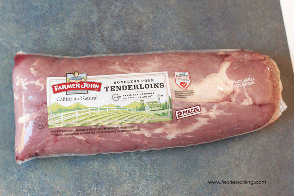 A package of Farmer John pork tenderloin on the counter.