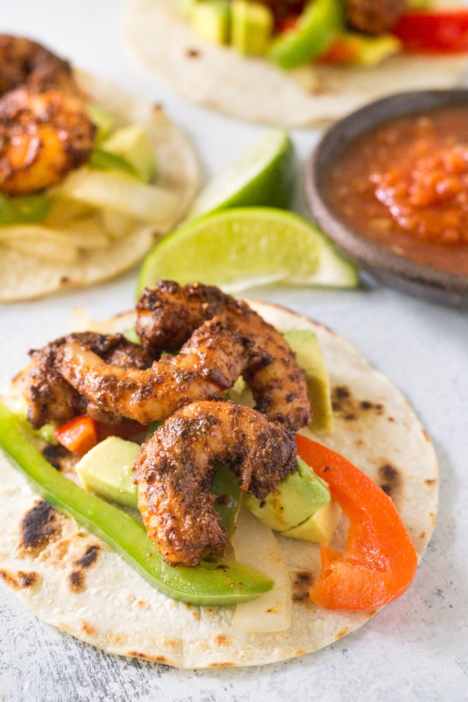 A close up of a blackened shrimp fajita.