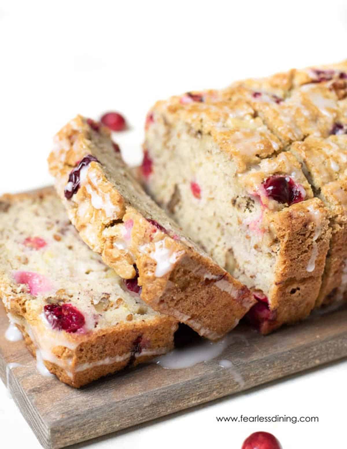 A sliced loaf of gluten free banana cranberry bread.