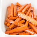 a baking dish of cooked carrots