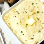A casserole dish filled with cream cheese mashed potatoes.