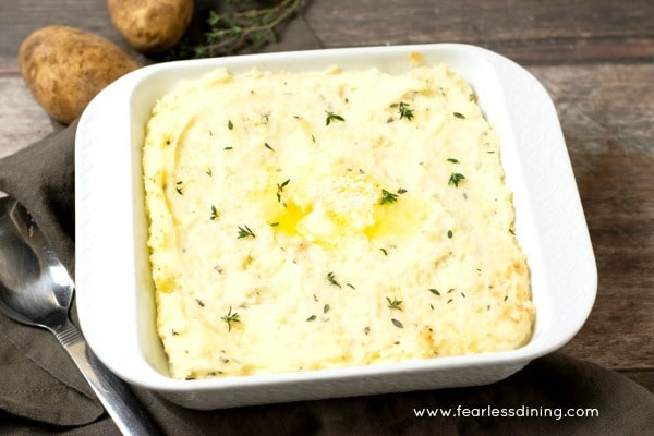 Baked mashed potatoes with cream cheese on a plate.