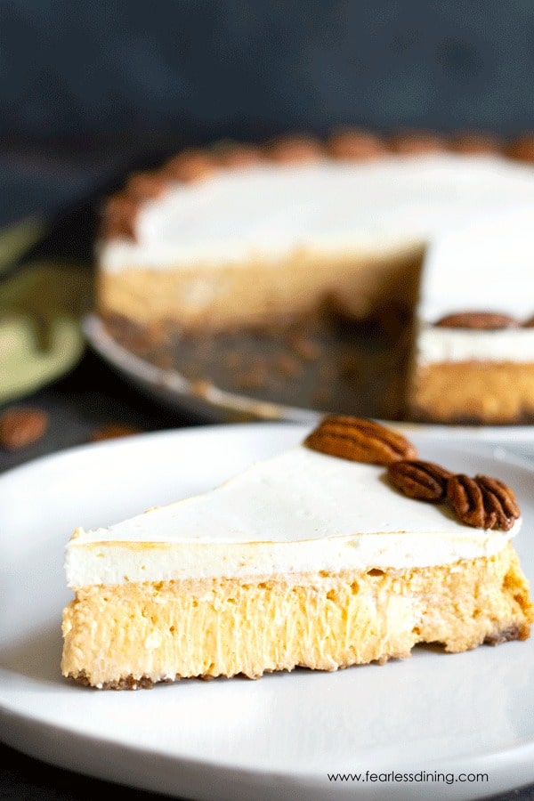 A slice of pumpkin cheesecake on a plate.