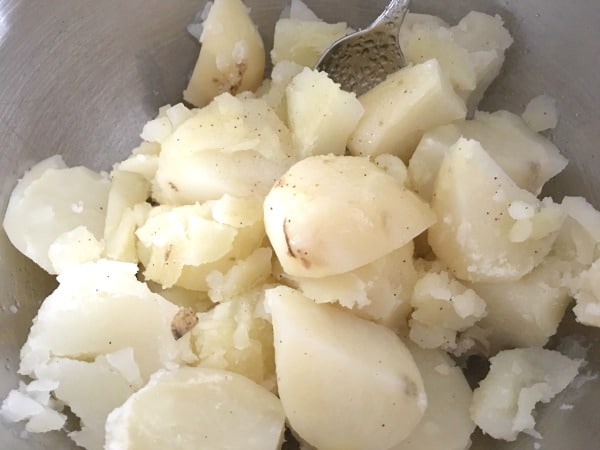 Cooked potatoes chunks in a bowl.