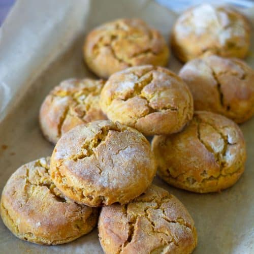 A bunch of gluten-free sweet potato scones on the baking tray.