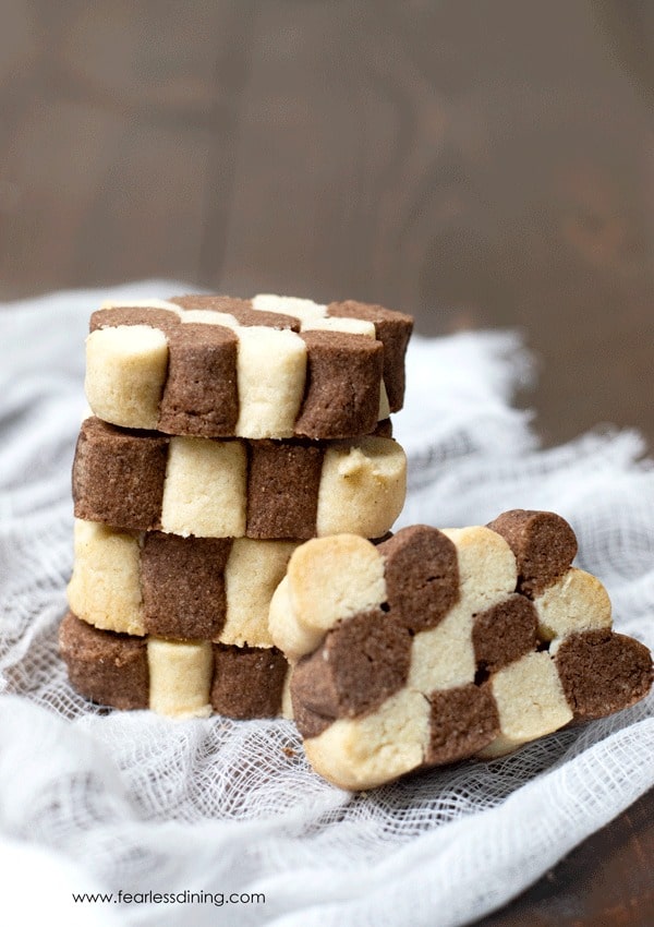 A stack of checkerboard black and white cookies.