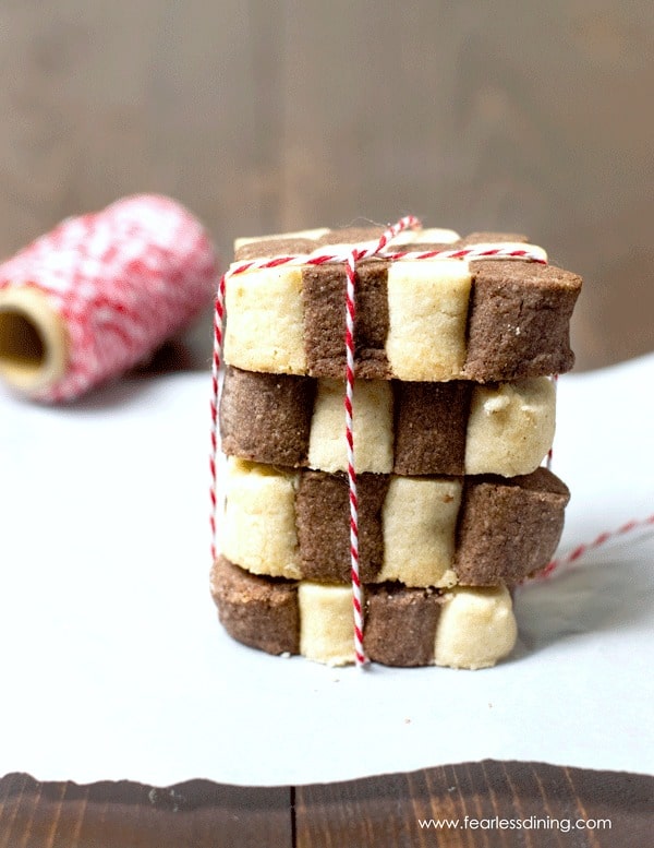 A stack of Czech black and white cookies tied with red and white baker's twine.