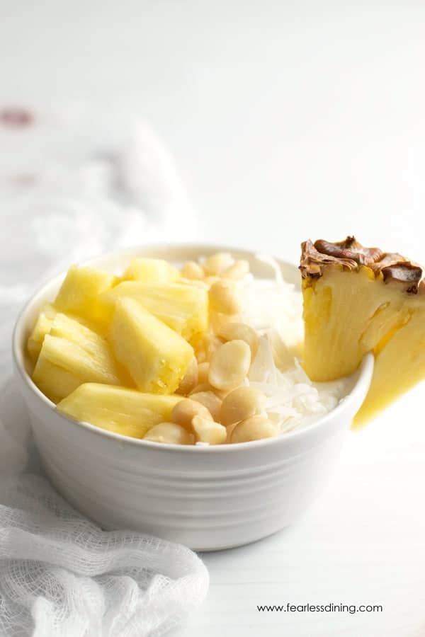 Pineapple, macadamia and coconut tropical yogurt bowls.