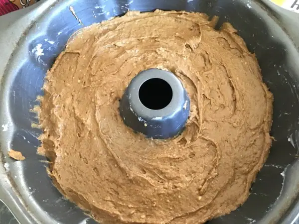 gingerbread cake batter in a bundt pan