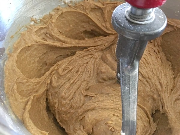 Gingerbread cake batter in a mixer.