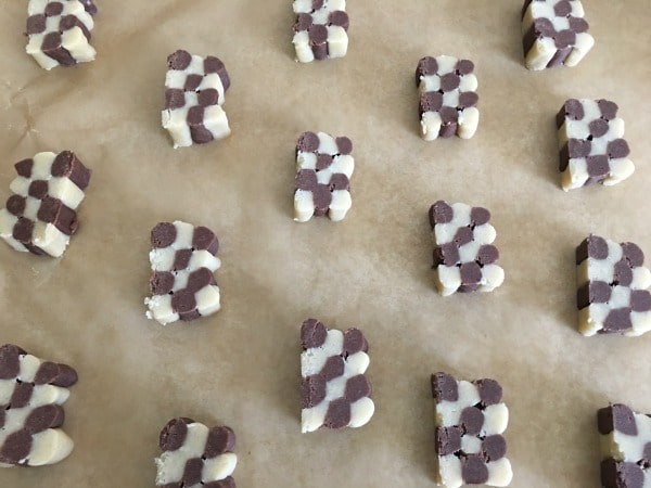 The checkerboard cookies on a cookie sheet about to be baked.