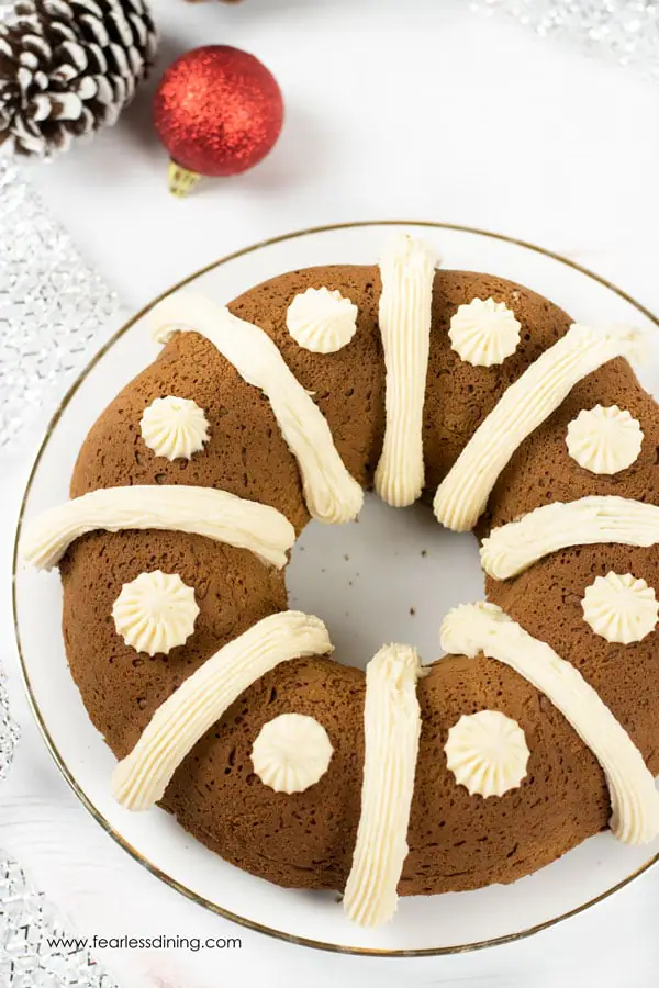 A gluten free gingerbread bundt cake with cream cheese frosting decoration.