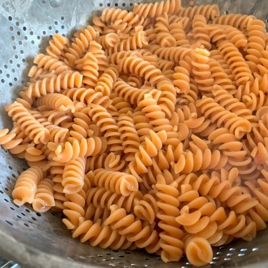 red lentil pasta in a colander