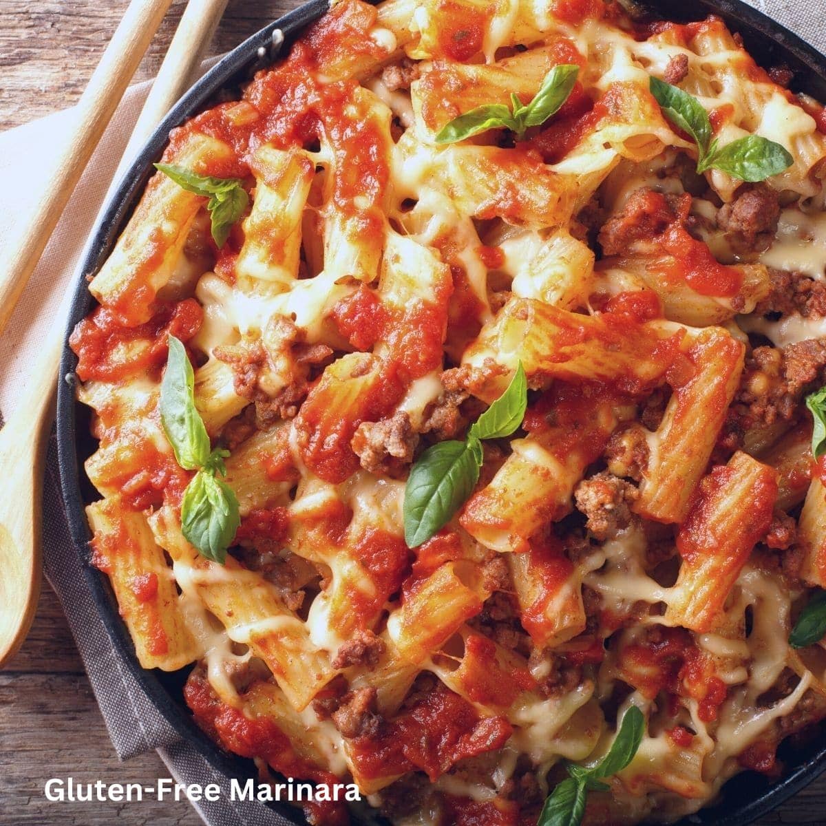 A bowl of gluten-free marinara sauce over pasta.