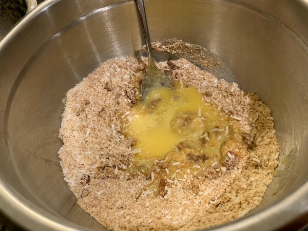 Adding the wet ingredients into the dry ingredients.