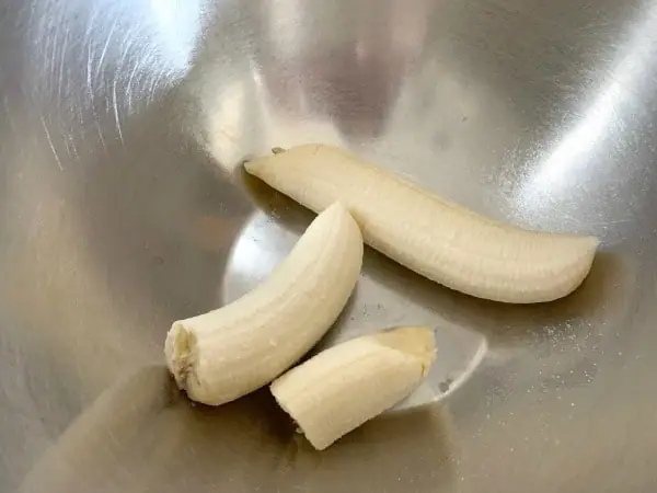 peeled bananas in a bowl ready to smash up