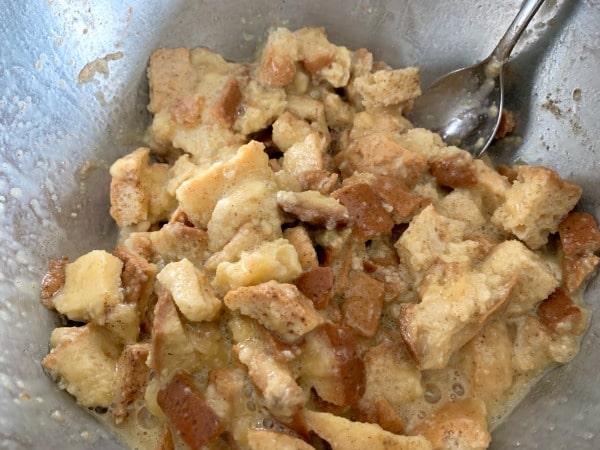 The bread cubes soaking in the egg and banana mixture.