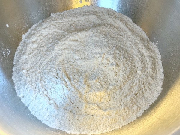 Dry cake ingredients in a bowl.