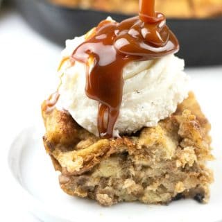Drizzling caramel over the banana bread pudding.