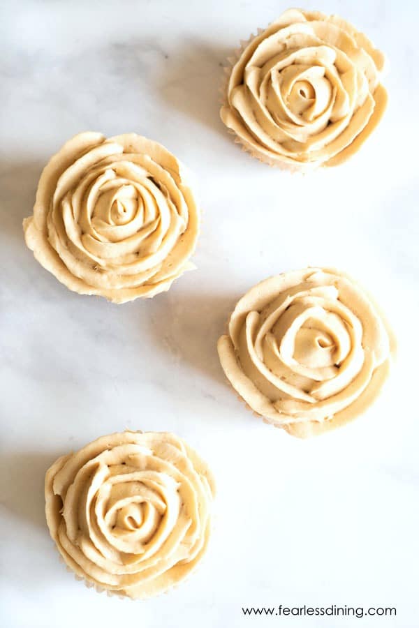 The top view of gluten free caramel cupcakes decorated like roses.