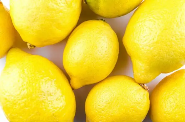 close up of lemons on a counter all pressed together