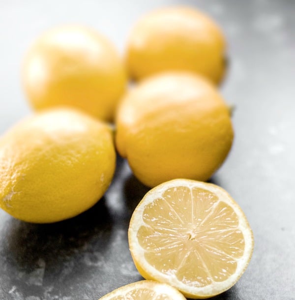 Lemons on a cutting board.