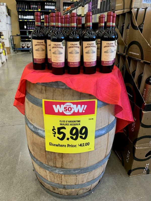 a display of wines on a barrel