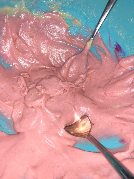 Pink cupcake batter in a bowl.