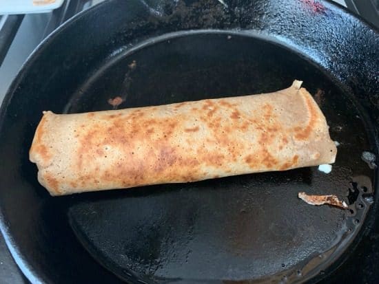 a rolled crepe in the pan