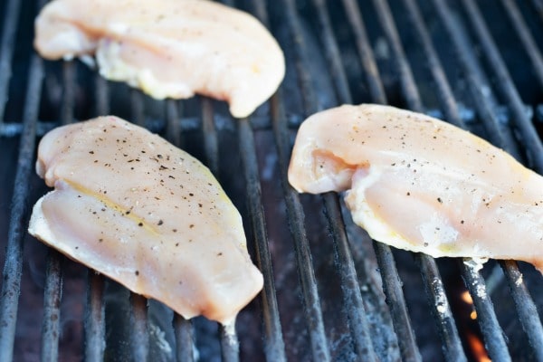 Photos of the chicken breasts cooking on the grill.