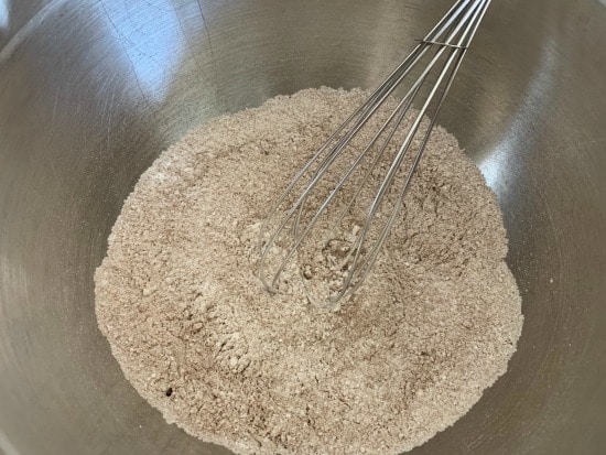 The crepe dry ingredients in a bowl with a whisk.