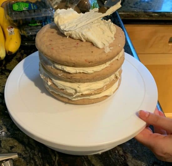 The layers of strawberry cake with frosting between each layer.