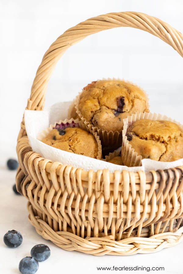 A basket of gluten free blueberry protein muffins.