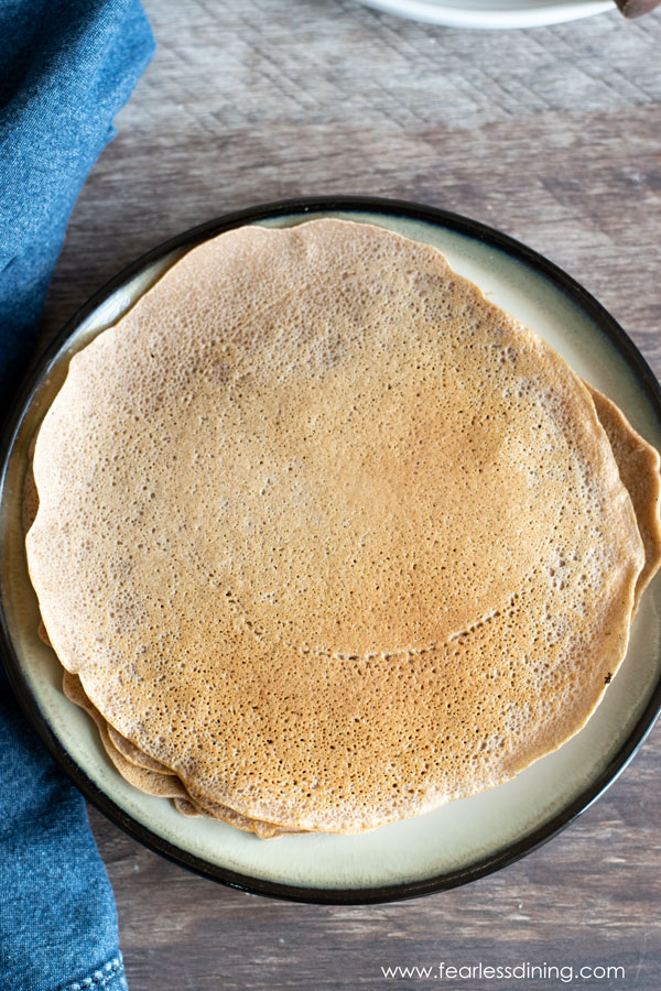 The top view of a plate of plain gluten free savory crepes.